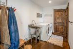 Full laundry room opens to the peaceful outdoor patio and hot tub